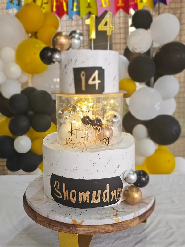 Illuminated Black and Gold Tier Cake